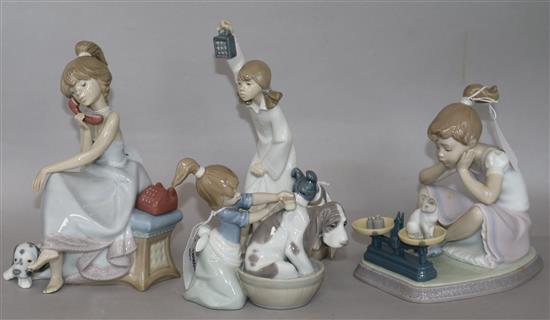 Three Lladro figures and a Nao figure, boxed, tallest 22cm (4)